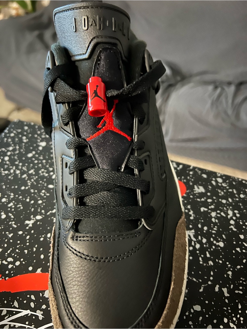 Jordan Men’s Black and Red Leather Sneakers